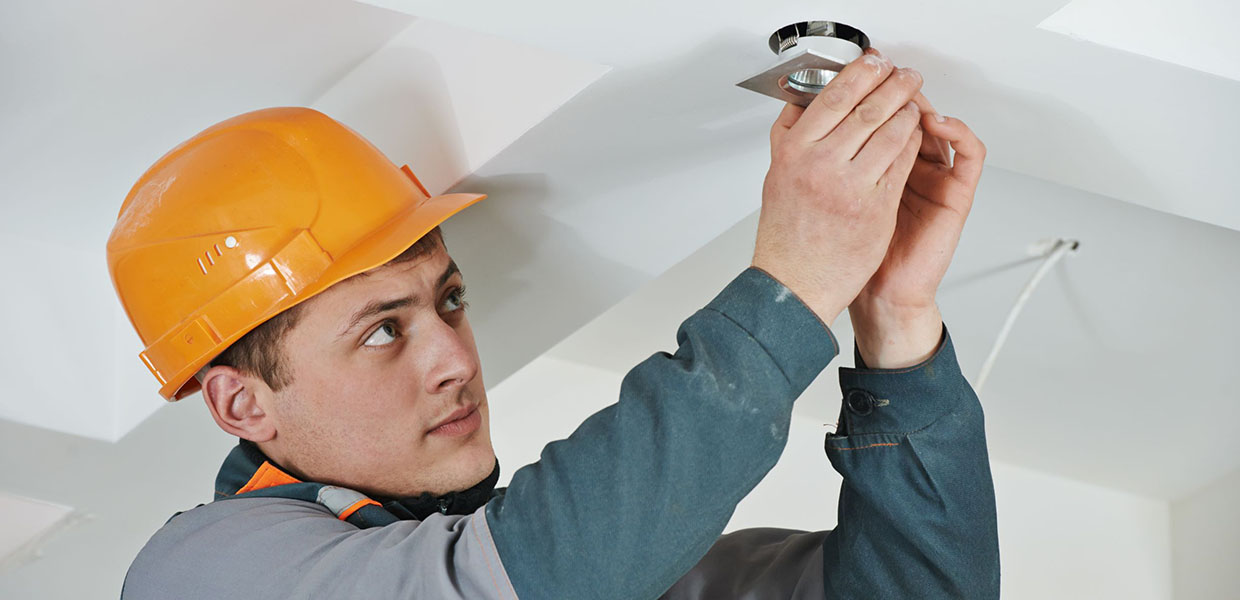 Worker Installing Lighting