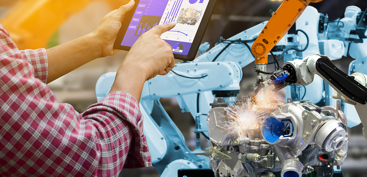 Person controlling robots with tablet