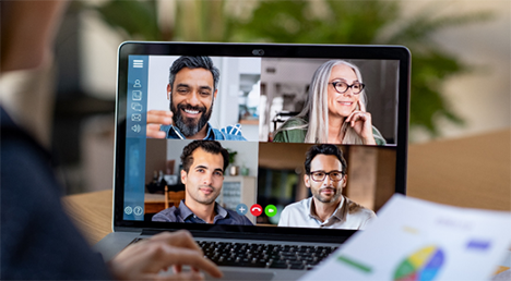 image of a person having a conference call on his laptop