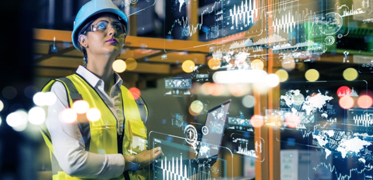 Woman in hardhat looking at data
